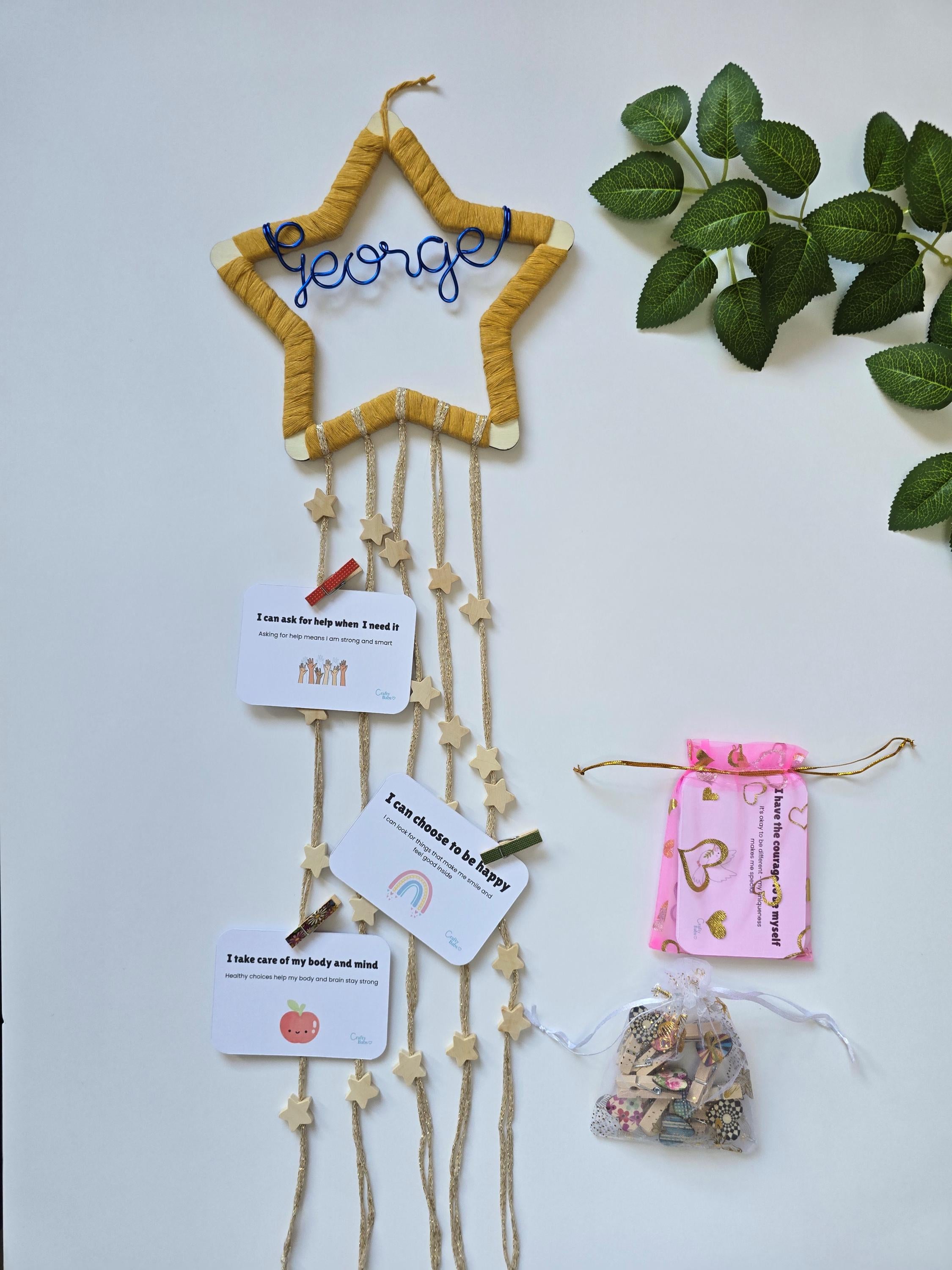 Handmade kids room wall decor with affirmation cards and peg clips