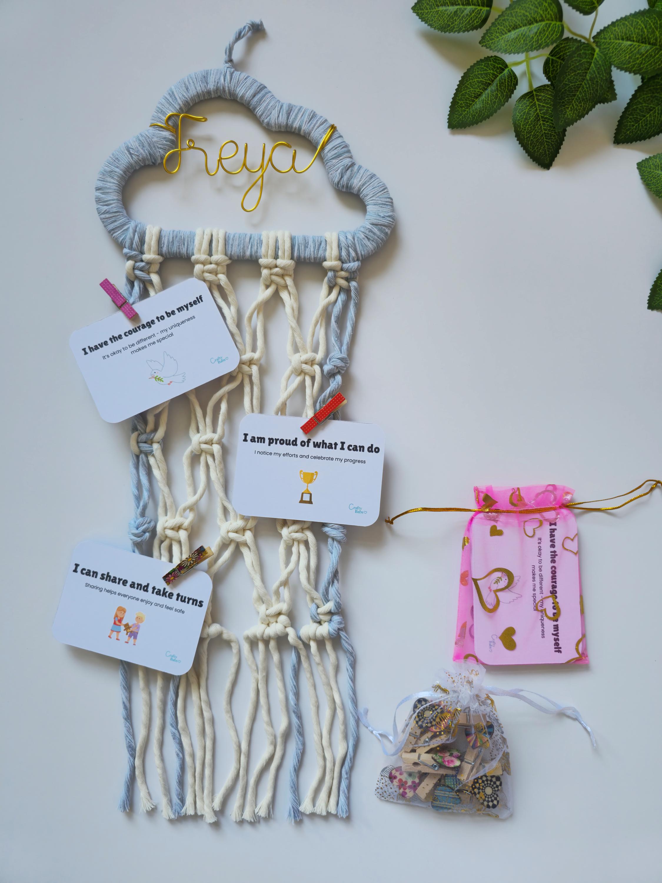 Handmade children’s affirmation wall hanging with positive affirmation cards and peg clips