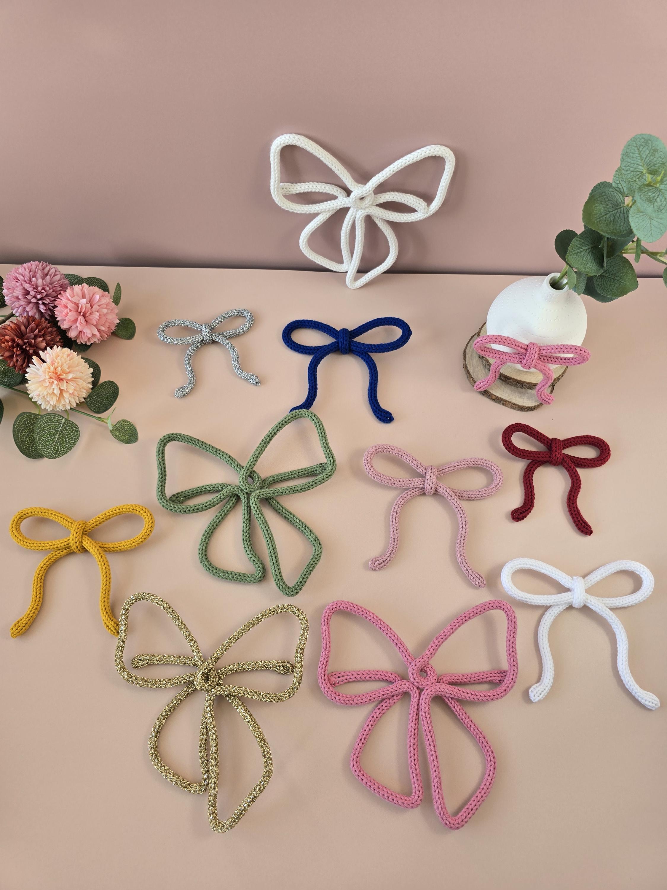 Small, medium and large knitted wire bow wall decor