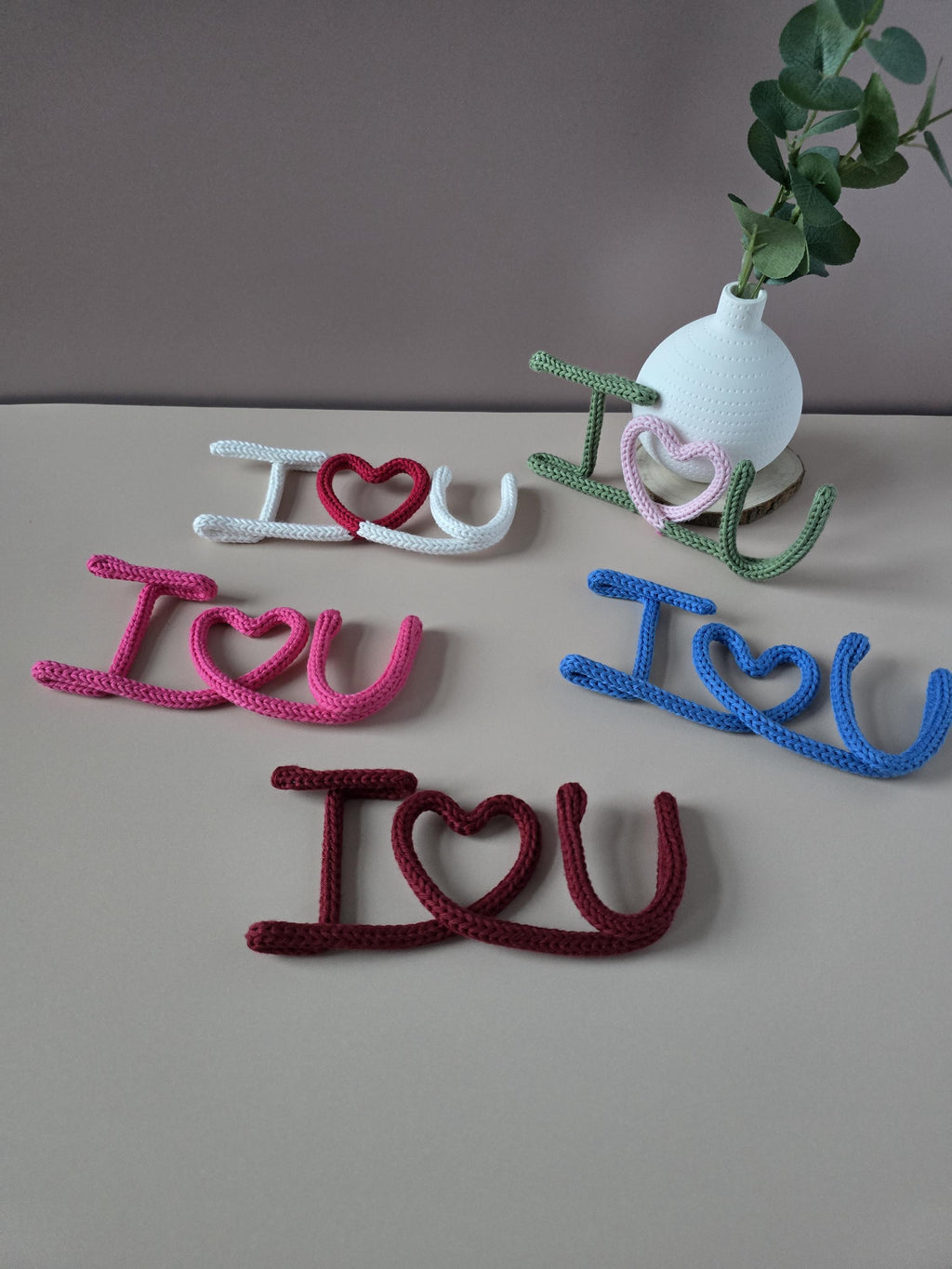I Love You knitted wire sign shown in blue, red and white