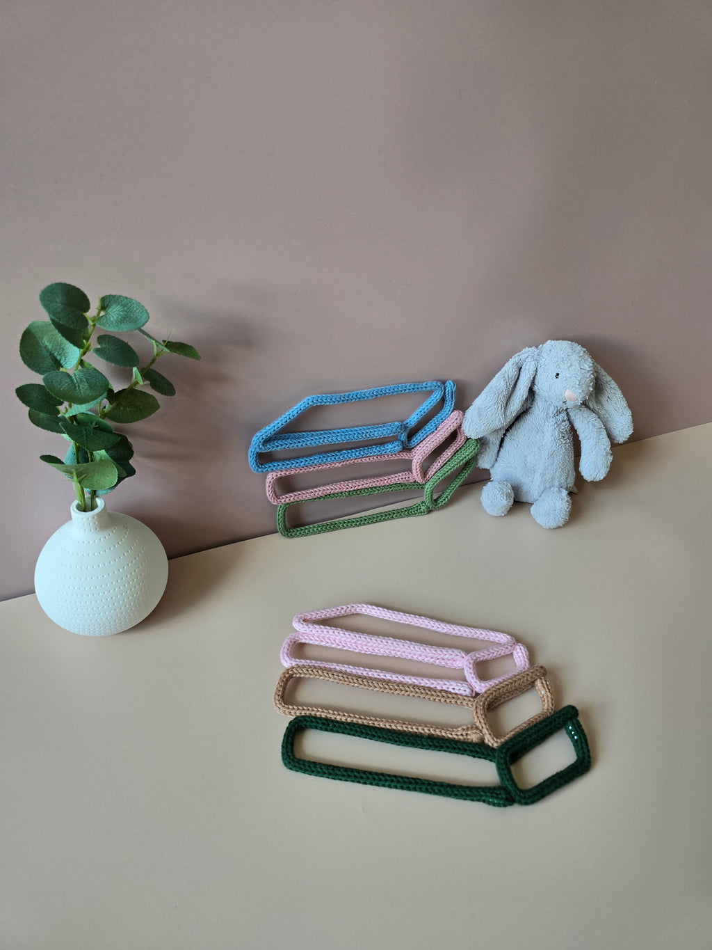 Book stack wall decor shown in a reading corner style display