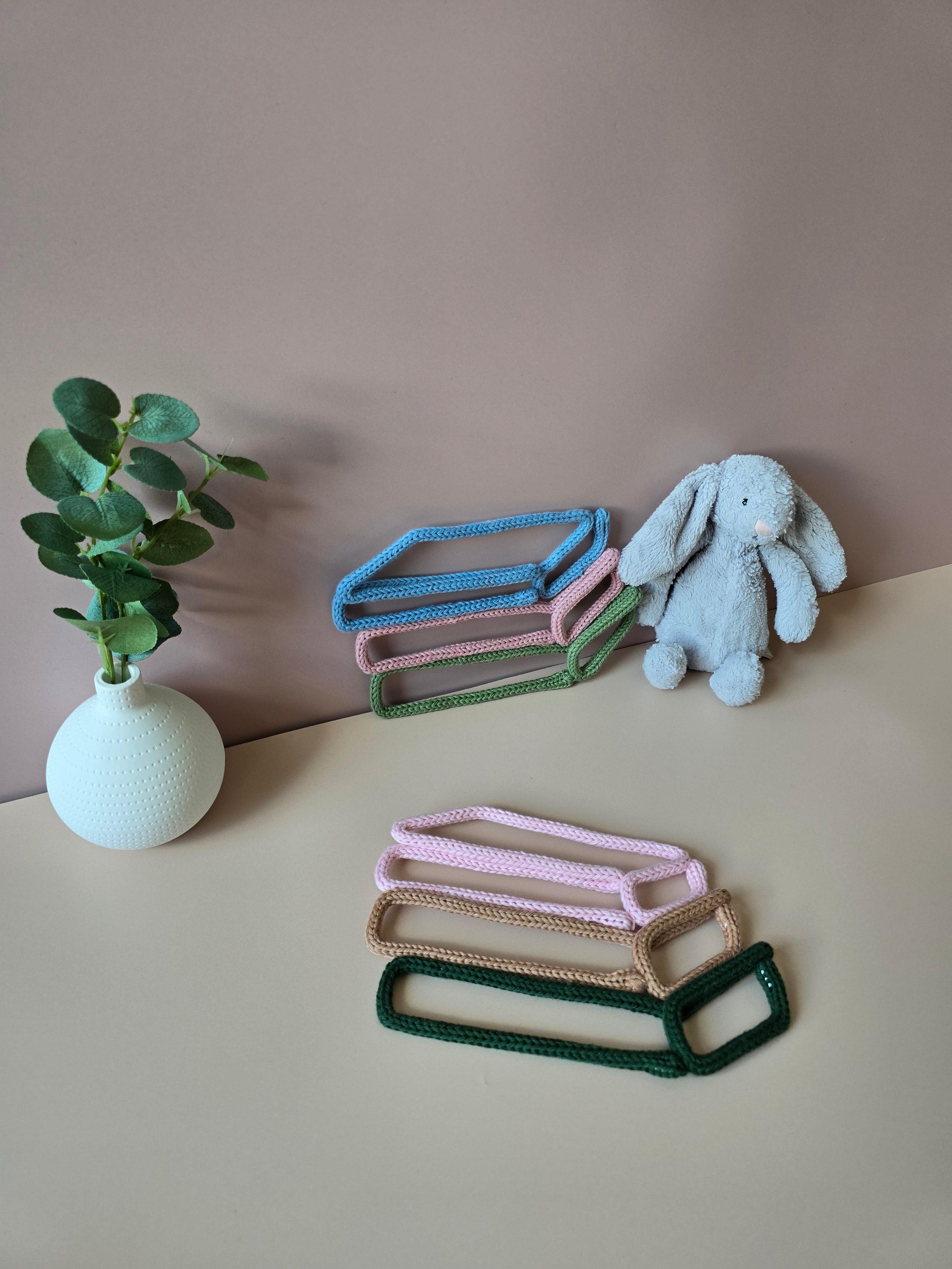 Book stack wall decor shown in a reading corner style display