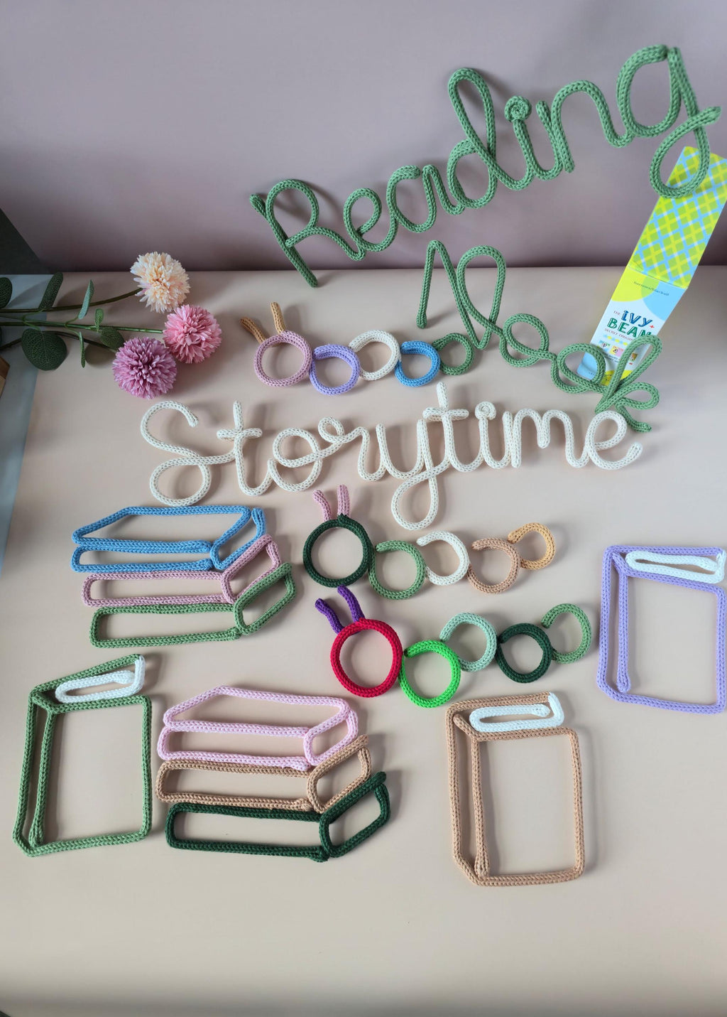 Bookworm decor styled with Storytime reading corner wall words