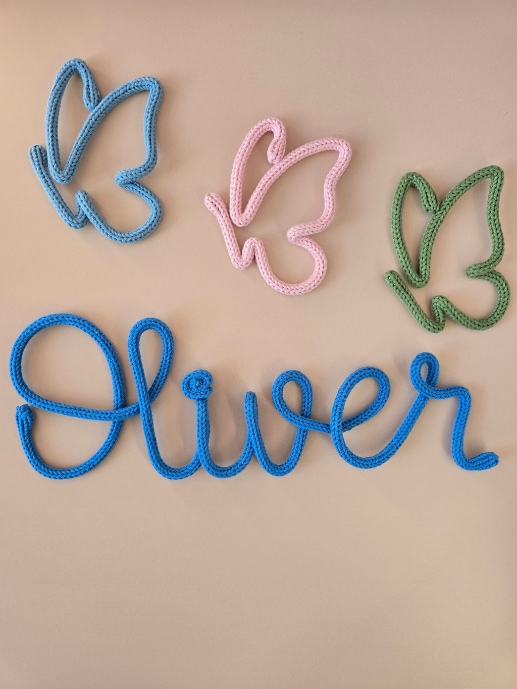 Knitted wire butterfly decor styled with a personalised name sign