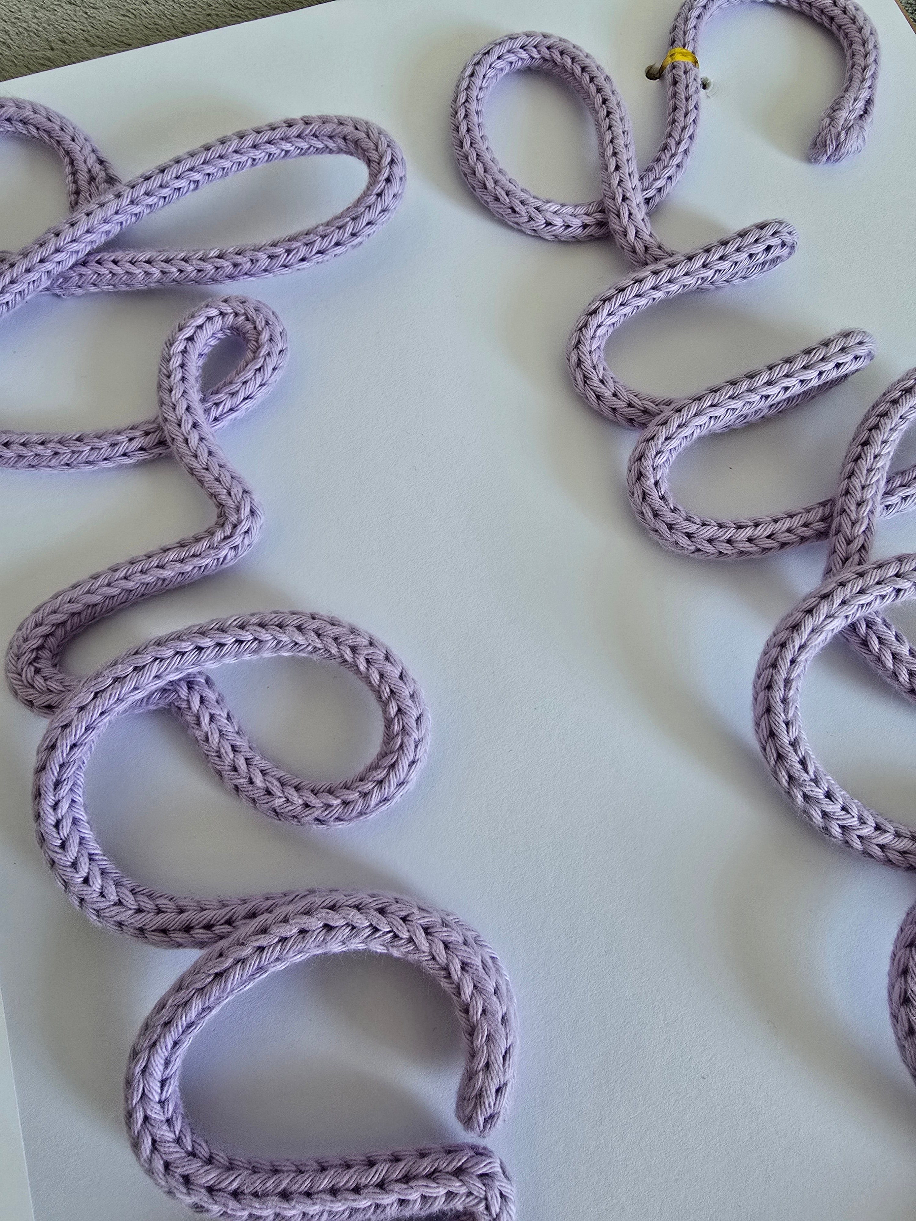 Close-up of the handmade Sweet dreams knitted wire sign