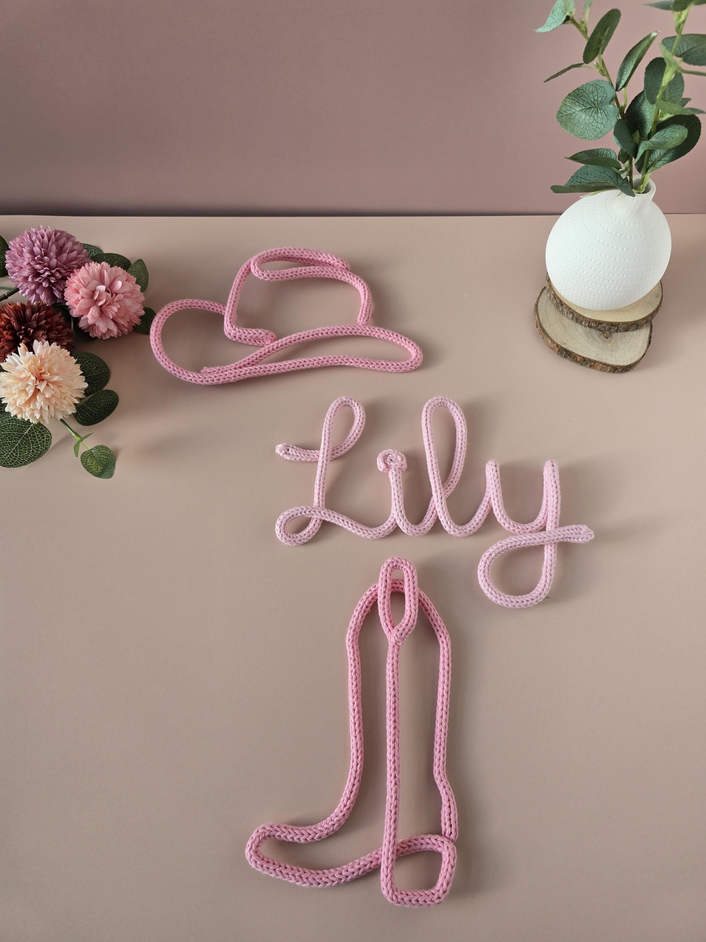 Cowboy boot and hat decor displayed with a personalised name sign