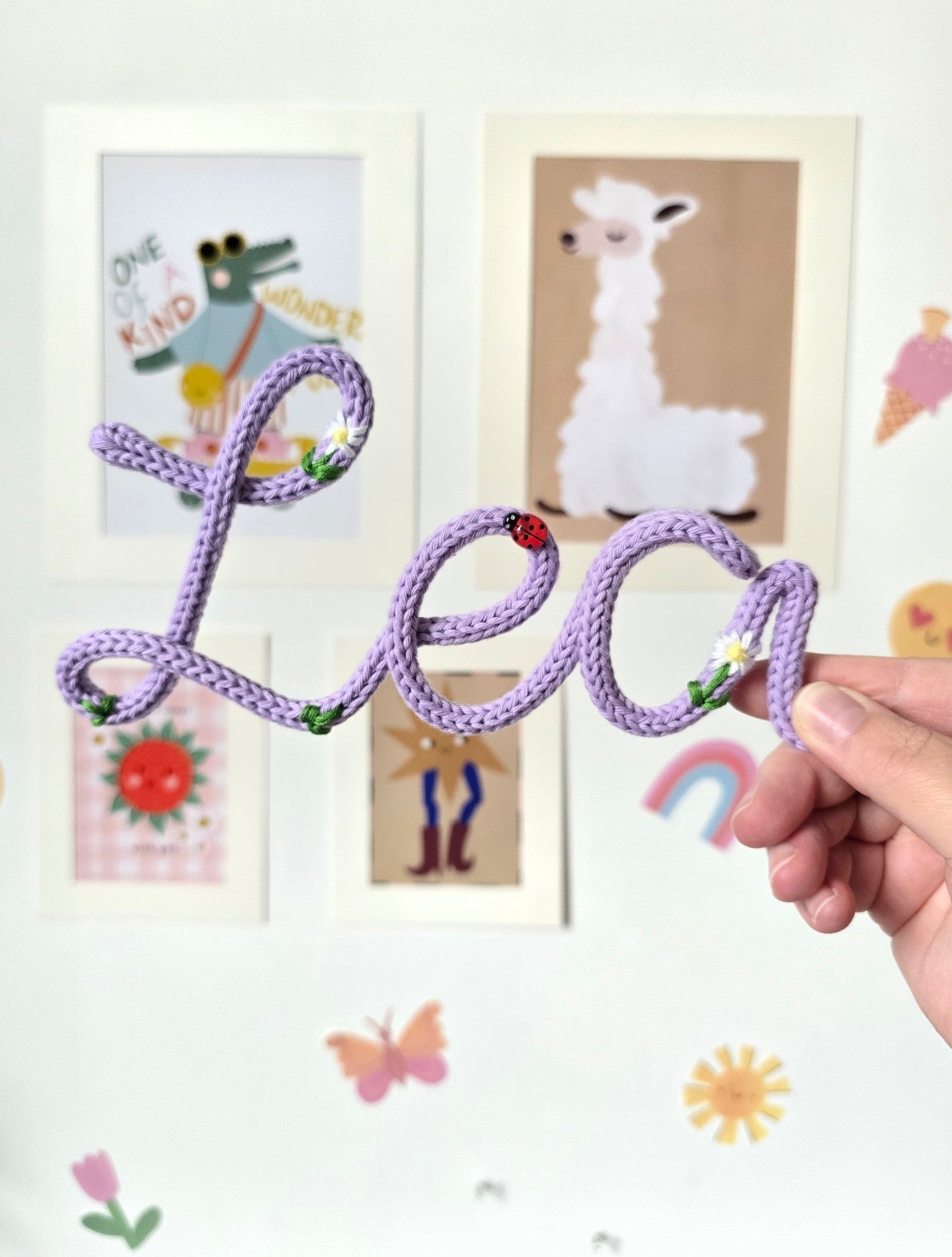 Lilac Lea embroidered knitted wire name sign showing the handmade embroidered details.