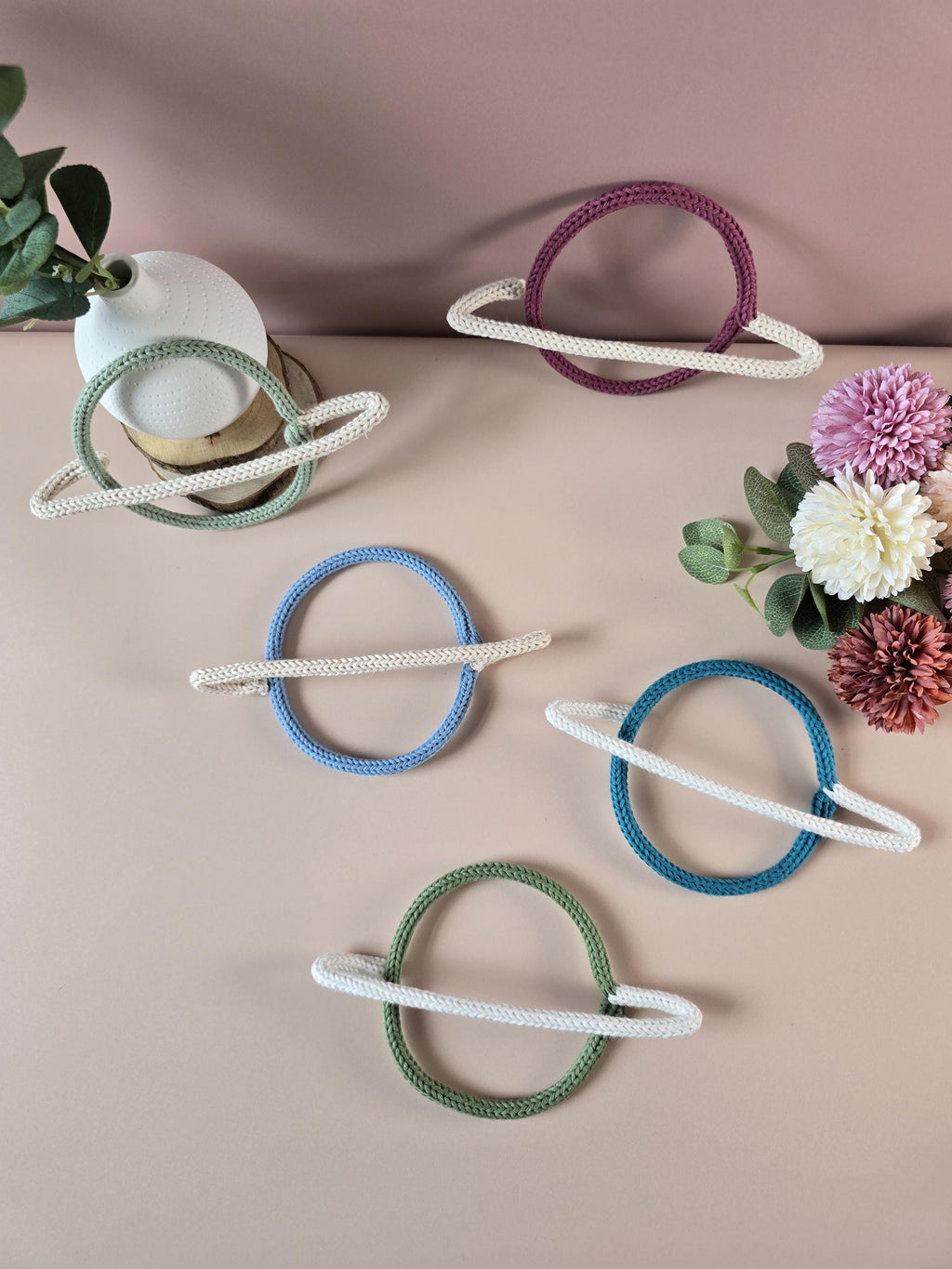 Neutral knitted wire Saturn planet wall decor for a space-themed room