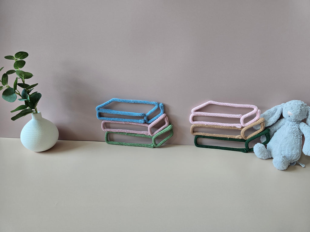 Handmade knitted wire book stack wall decor in two colour combinations