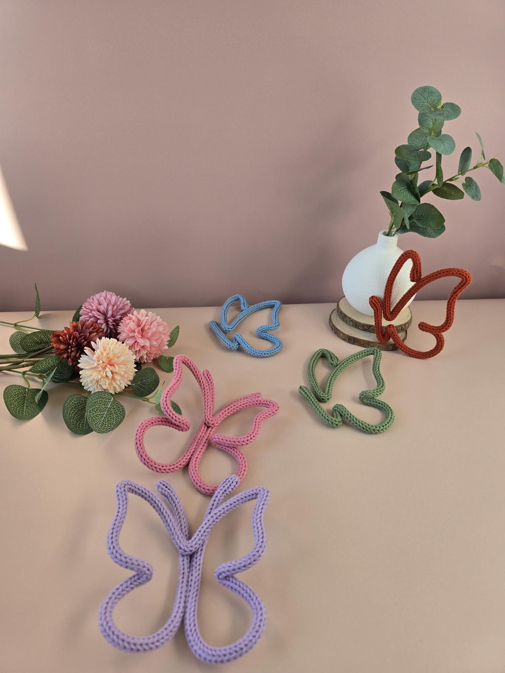 Knitted wire butterfly decorations shown in different colour options