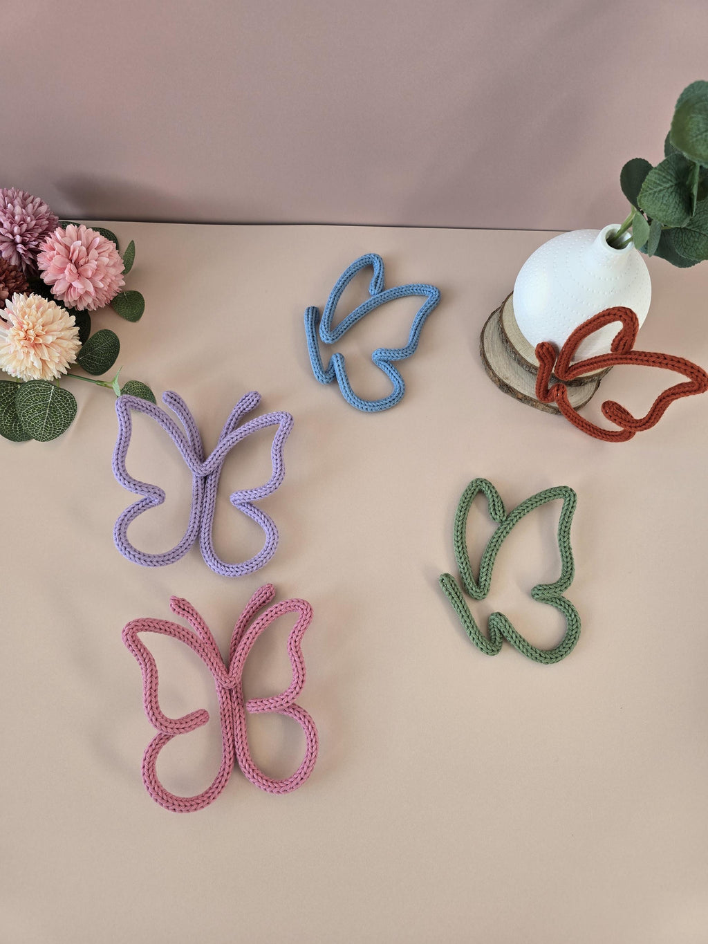 Knitted wire butterfly decorations shown in different colour options