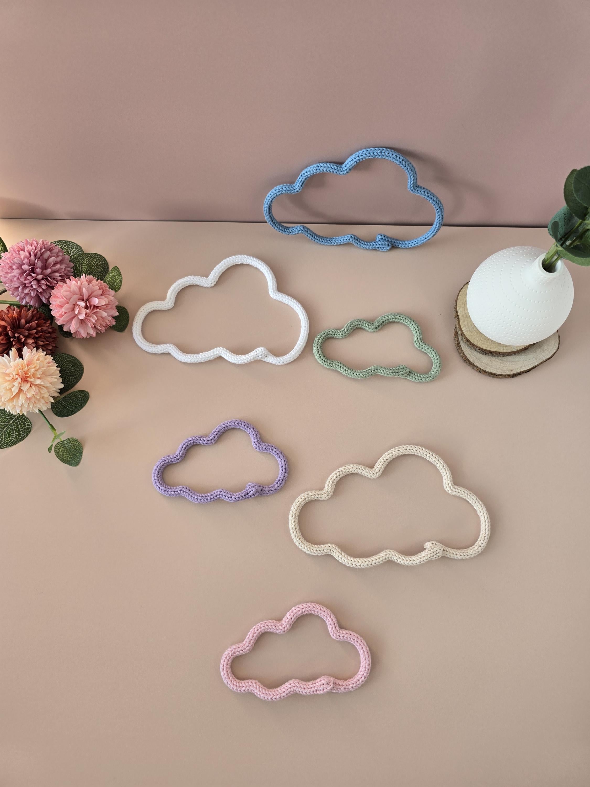 Knitted wire cloud wall decor shown in different colour options
