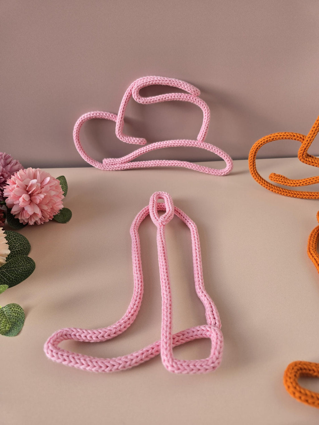 Handmade knitted wire cowboy boot and hat decor in soft cotton yarn
