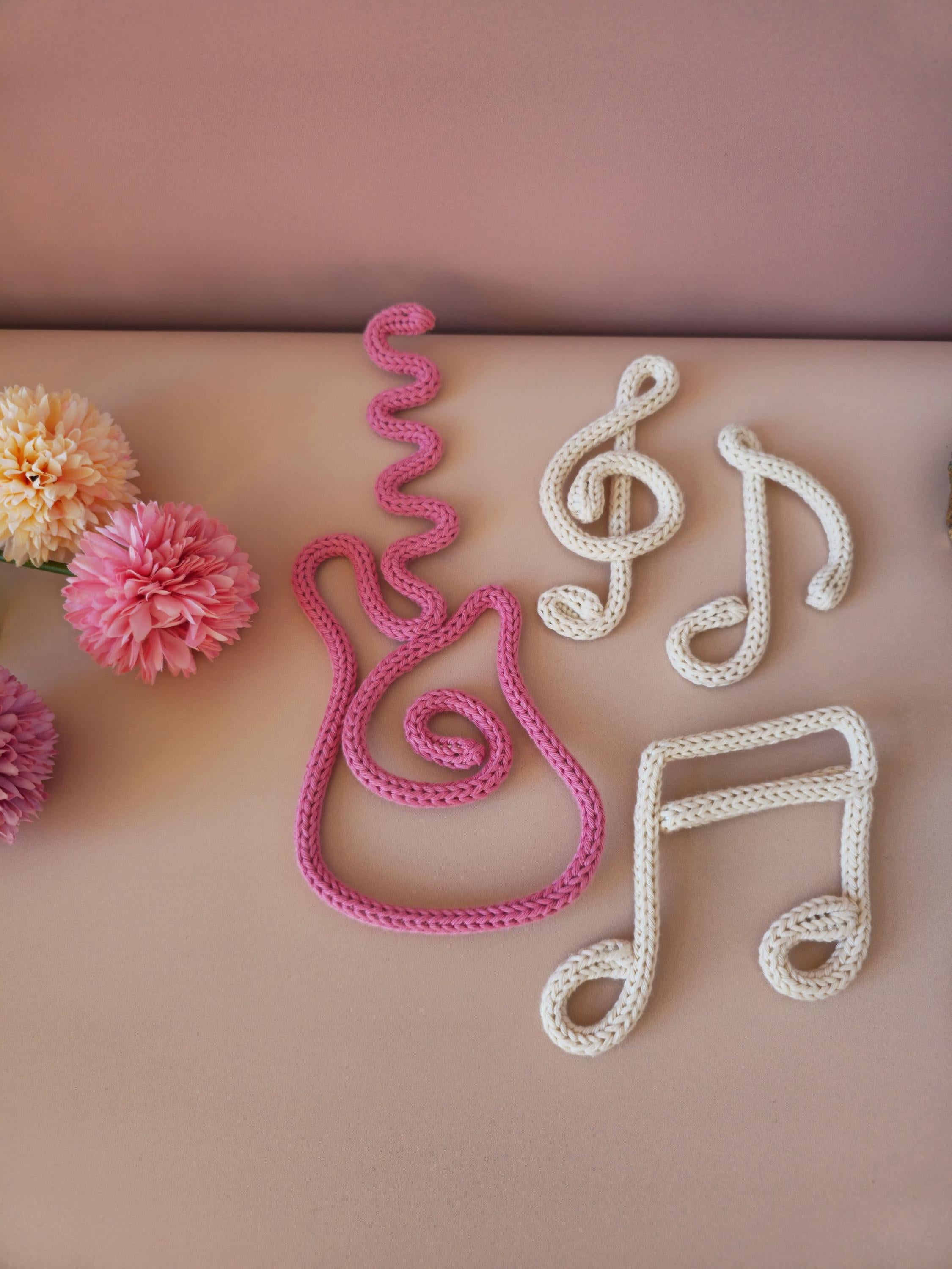 Knitted wire guitar and music notes set, handmade music-themed wall decor for children’s rooms and nurseries.
