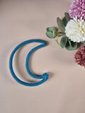 Handmade knitted wire moon wall decor in blue