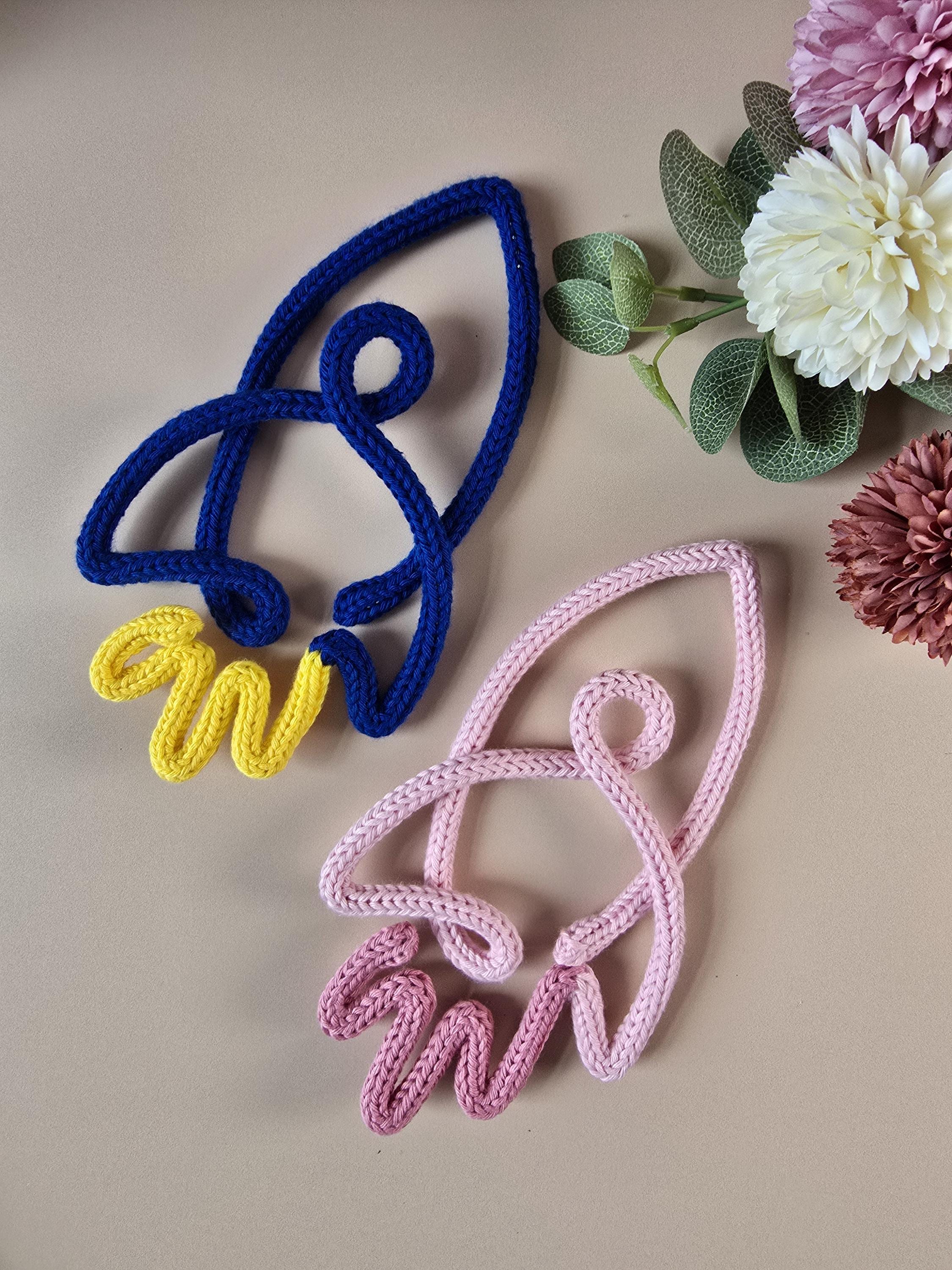 Handmade knitted wire rocket wall decor in two colour combinations