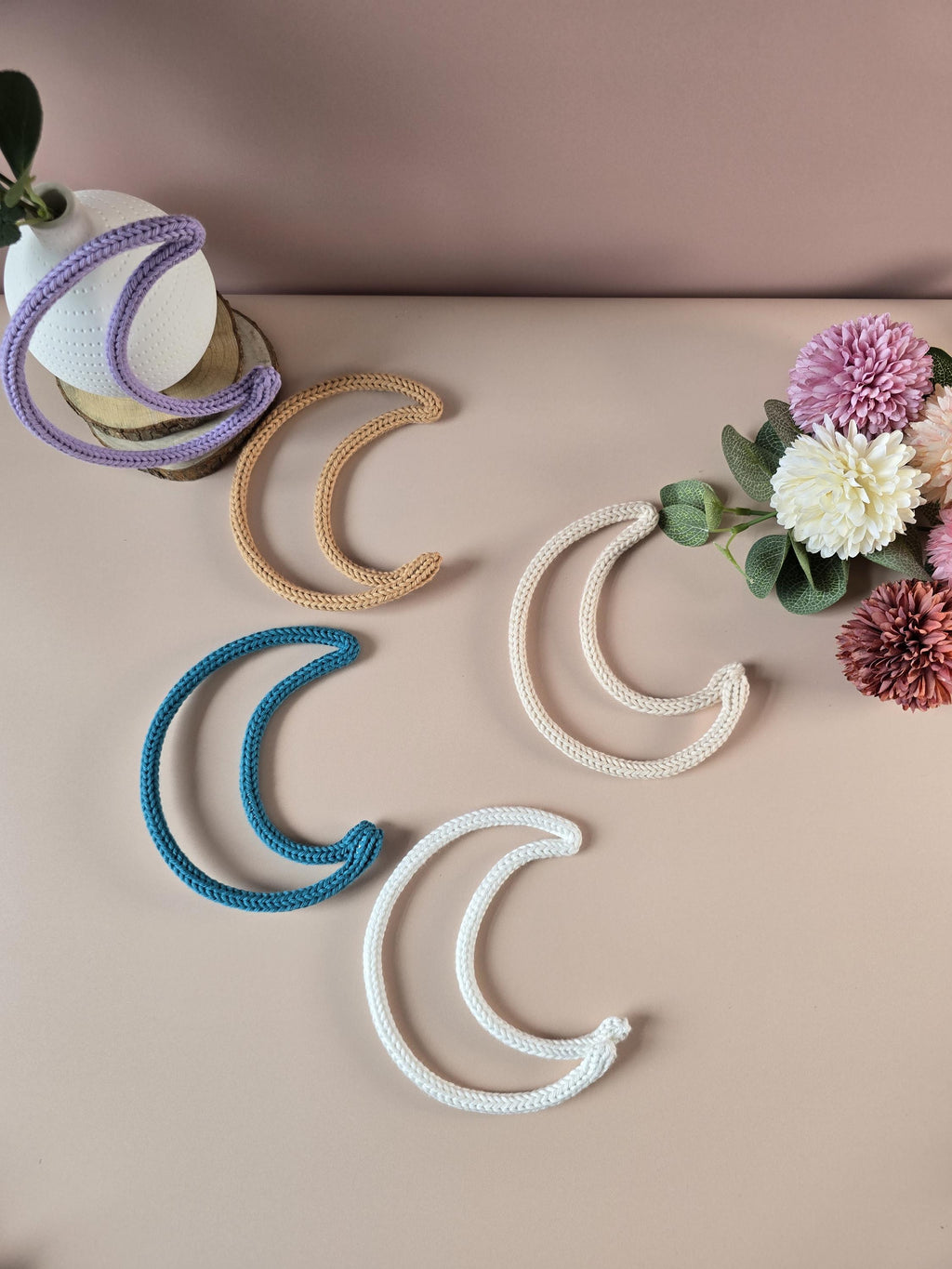 Knitted wire moon decoration used as an add-on for a personalised name sign