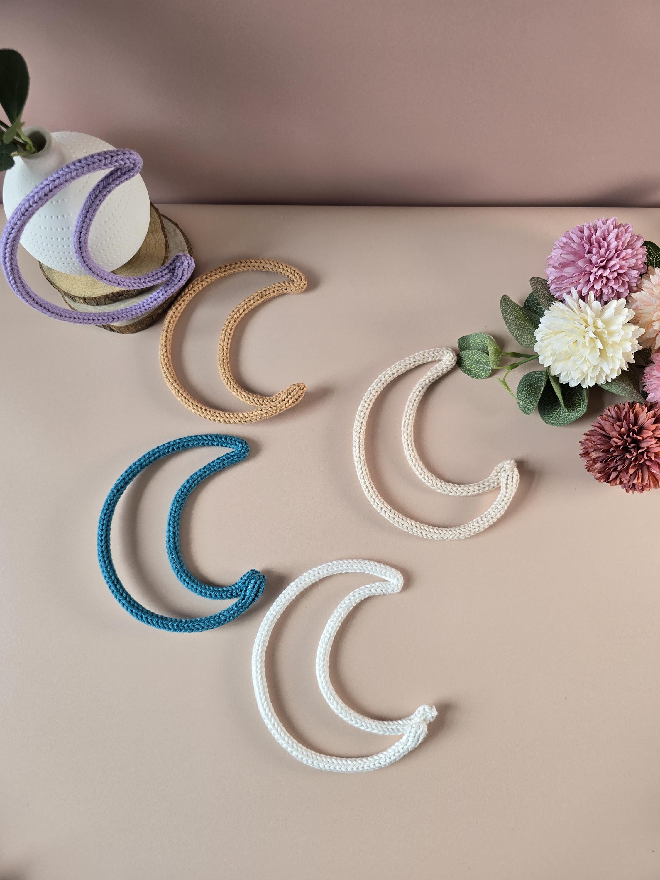Knitted wire moon decoration used as an add-on for a personalised name sign