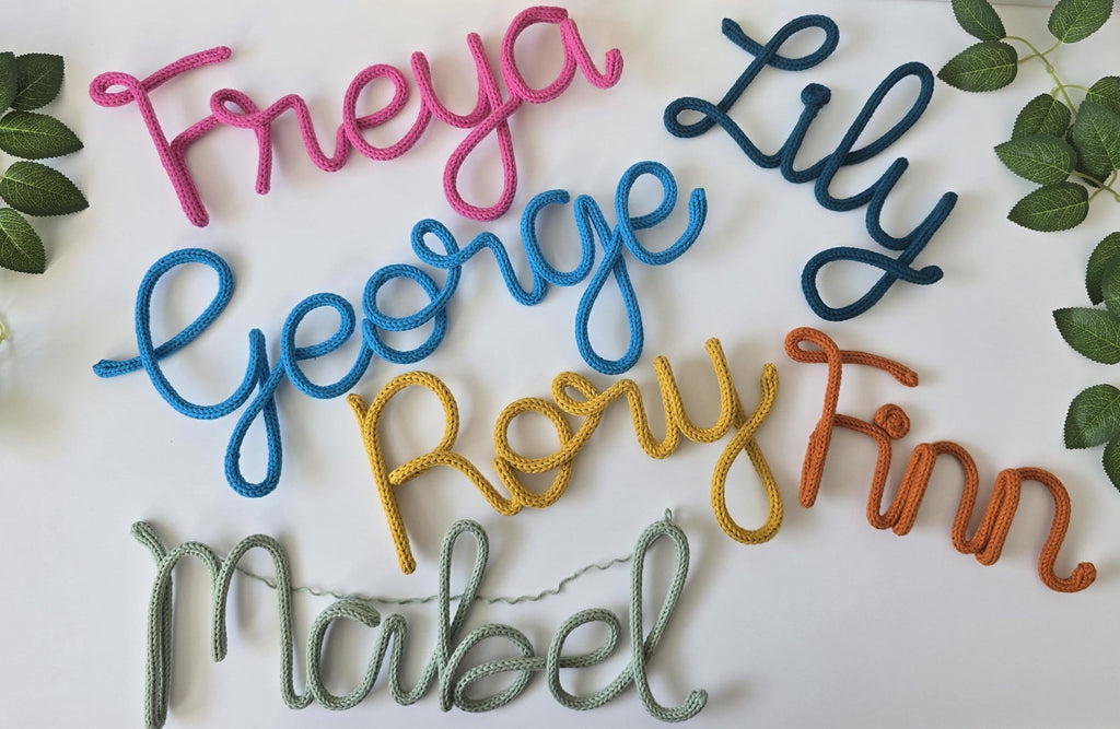 Personalised knitted wire name signs in different colours