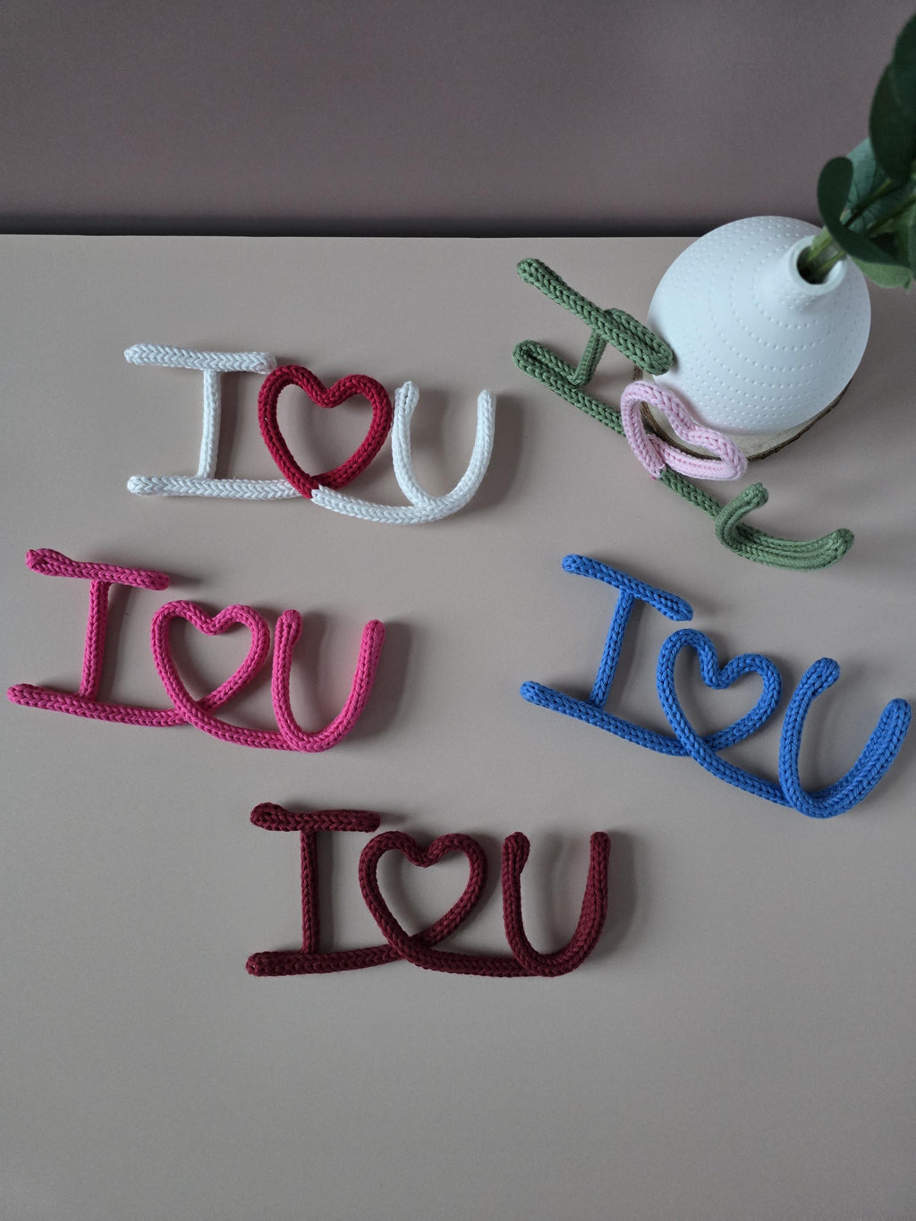 Pink knitted wire I Love You sign handmade from cotton yarn