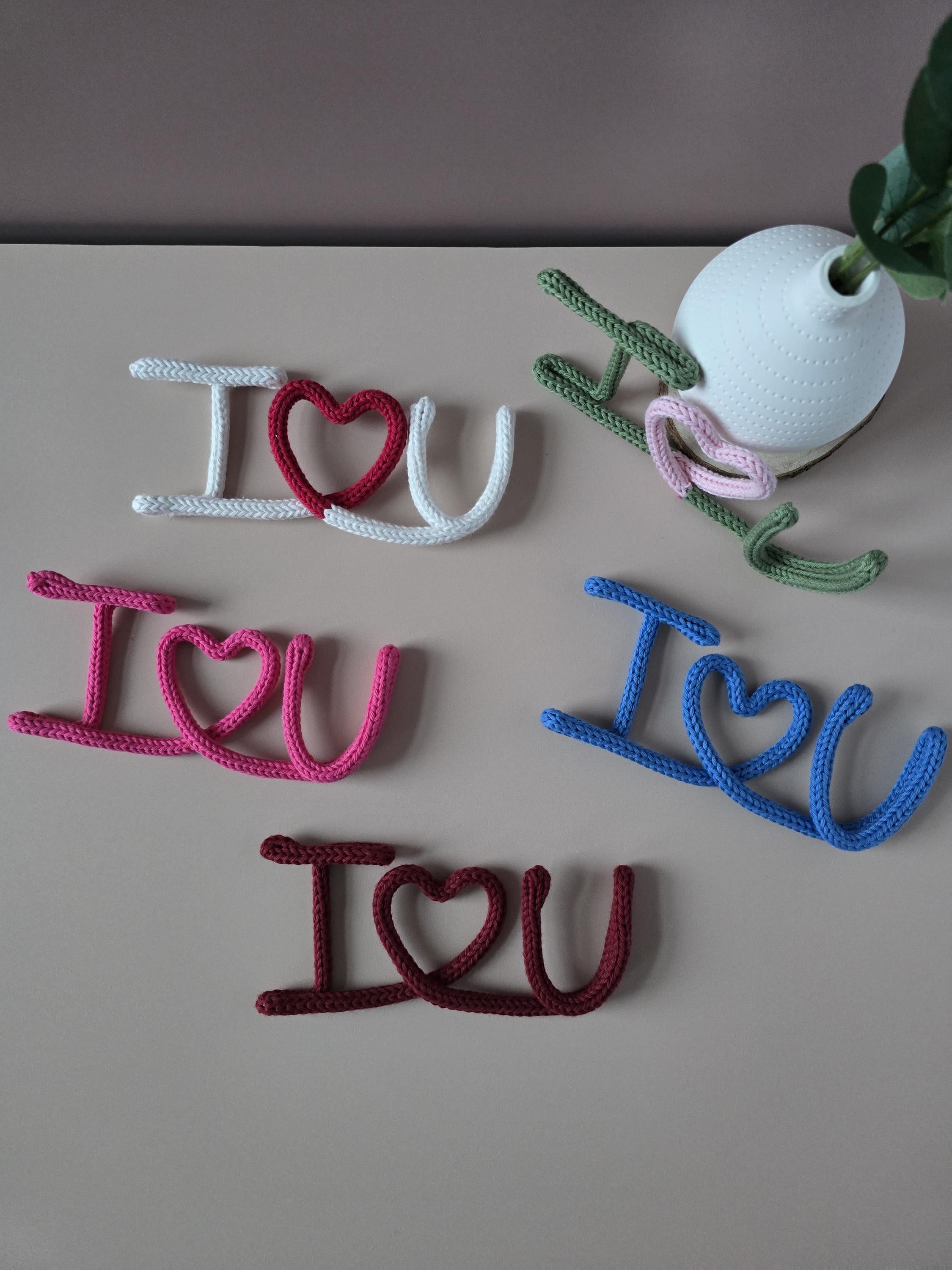 Pink knitted wire I Love You sign handmade from cotton yarn