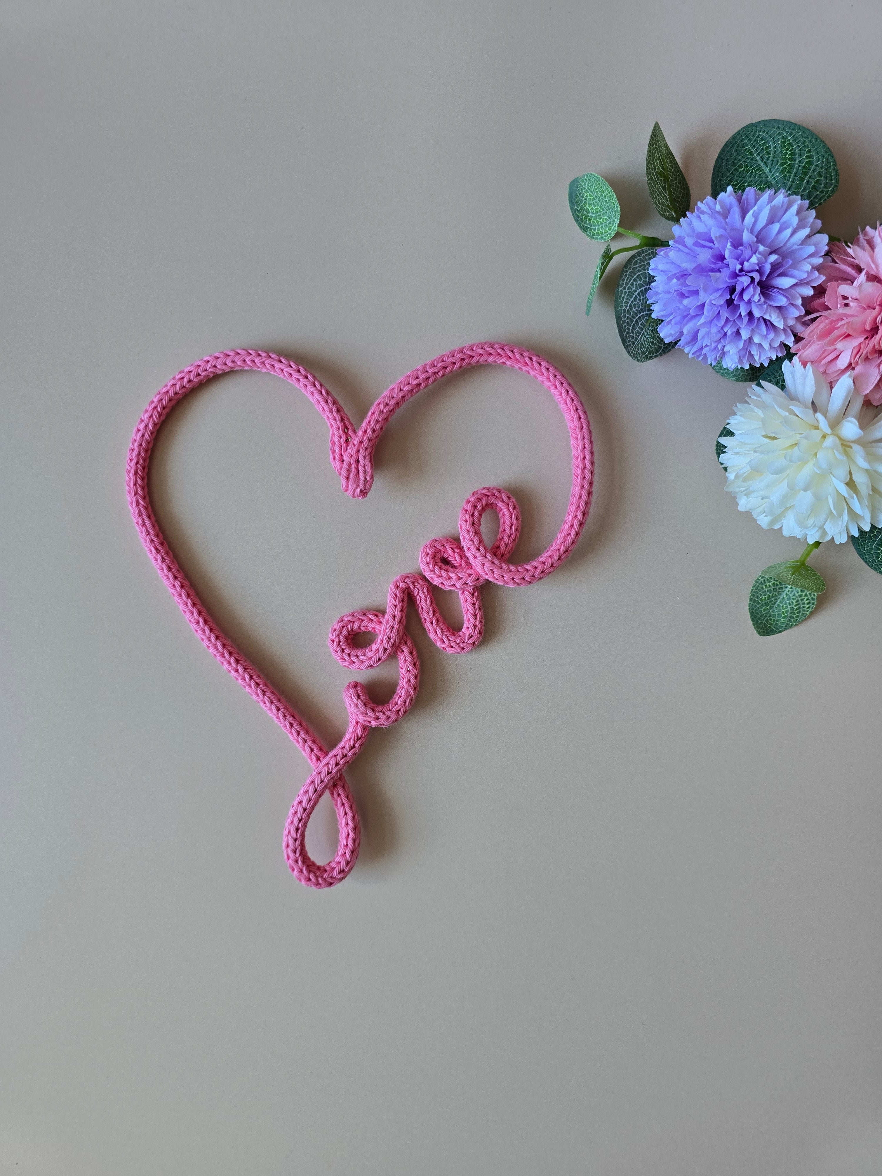Handmade knitted wire love heart wall decor in pink