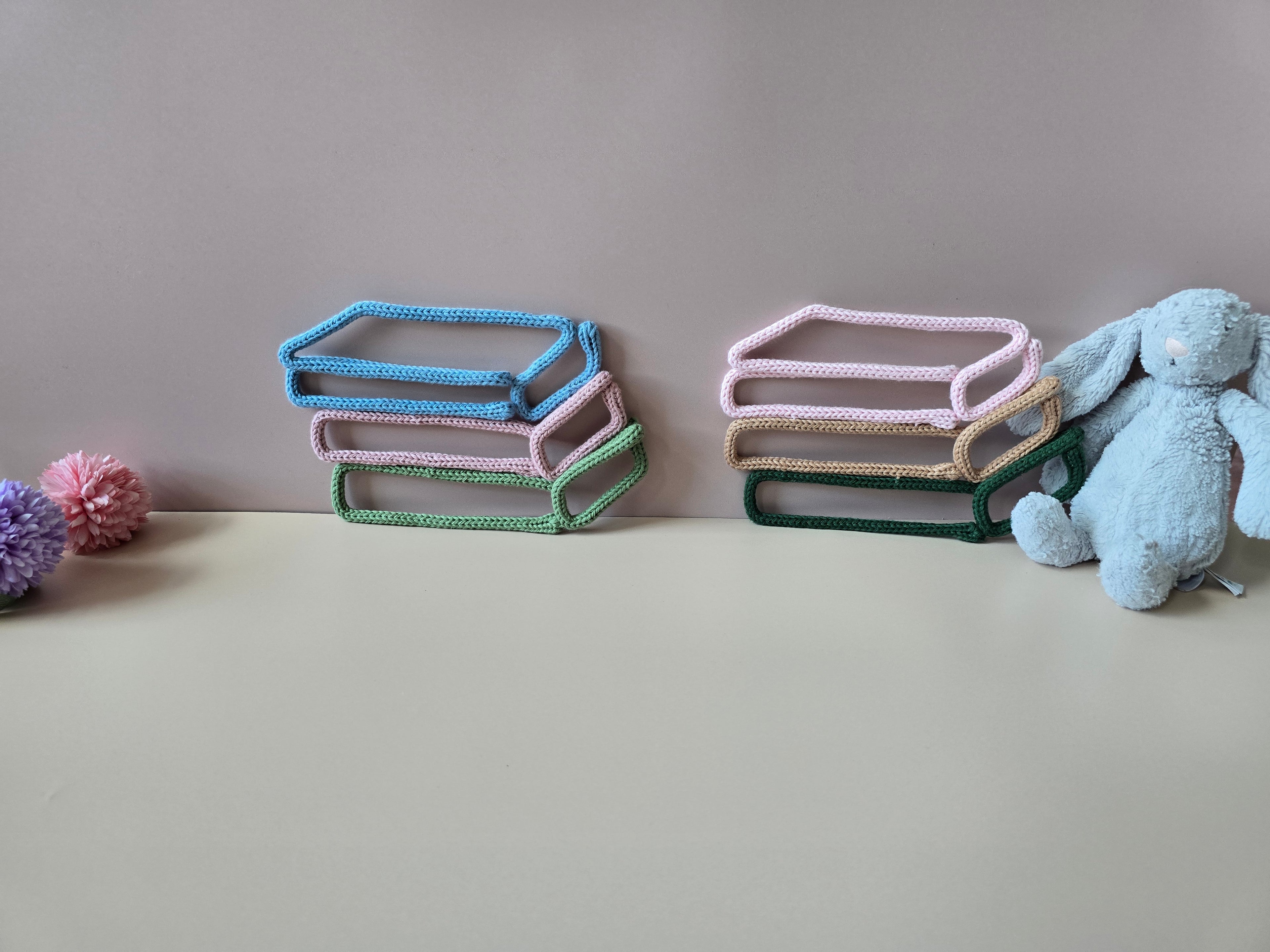 Handmade book stack wall decor styled for a nursery or reading