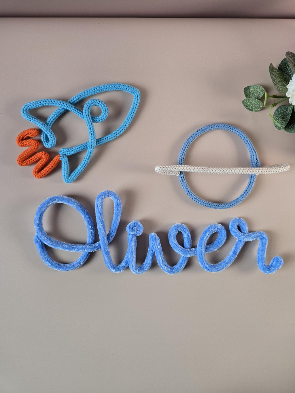 Knitted wire Saturn planet decor styled beside a personalised name sign