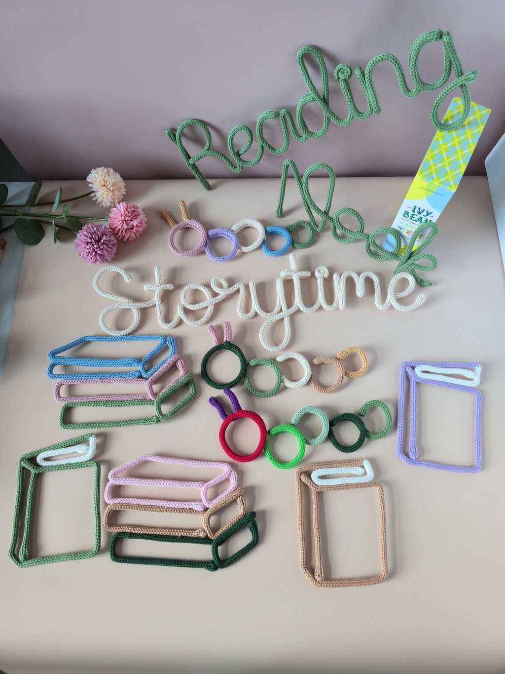 Single book knitted wire decor styled with reading nook wall decorations