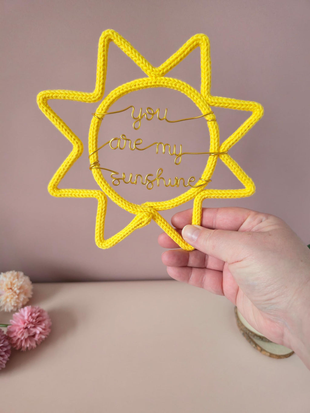 Knitted wire sunshine sign with coloured wire wording for a baby room or kids’ bedroom